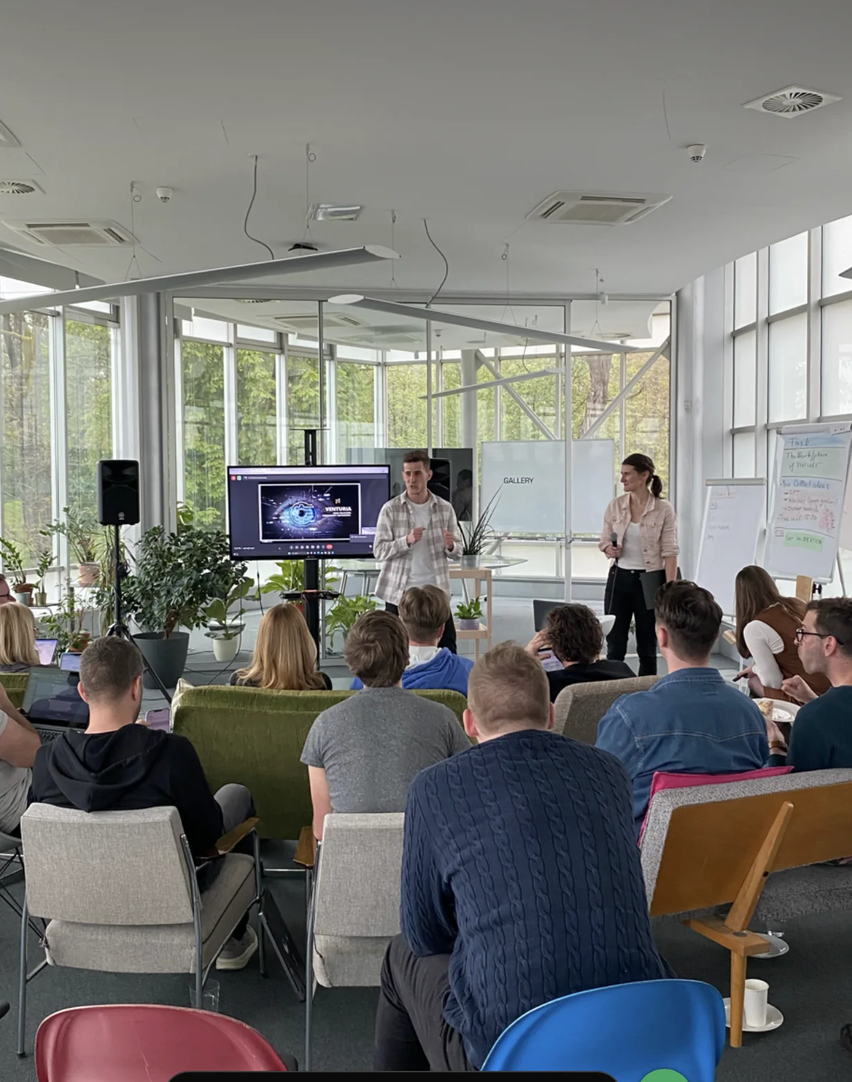 Founders presenting and challenging venture concepts during a working session in Prague
